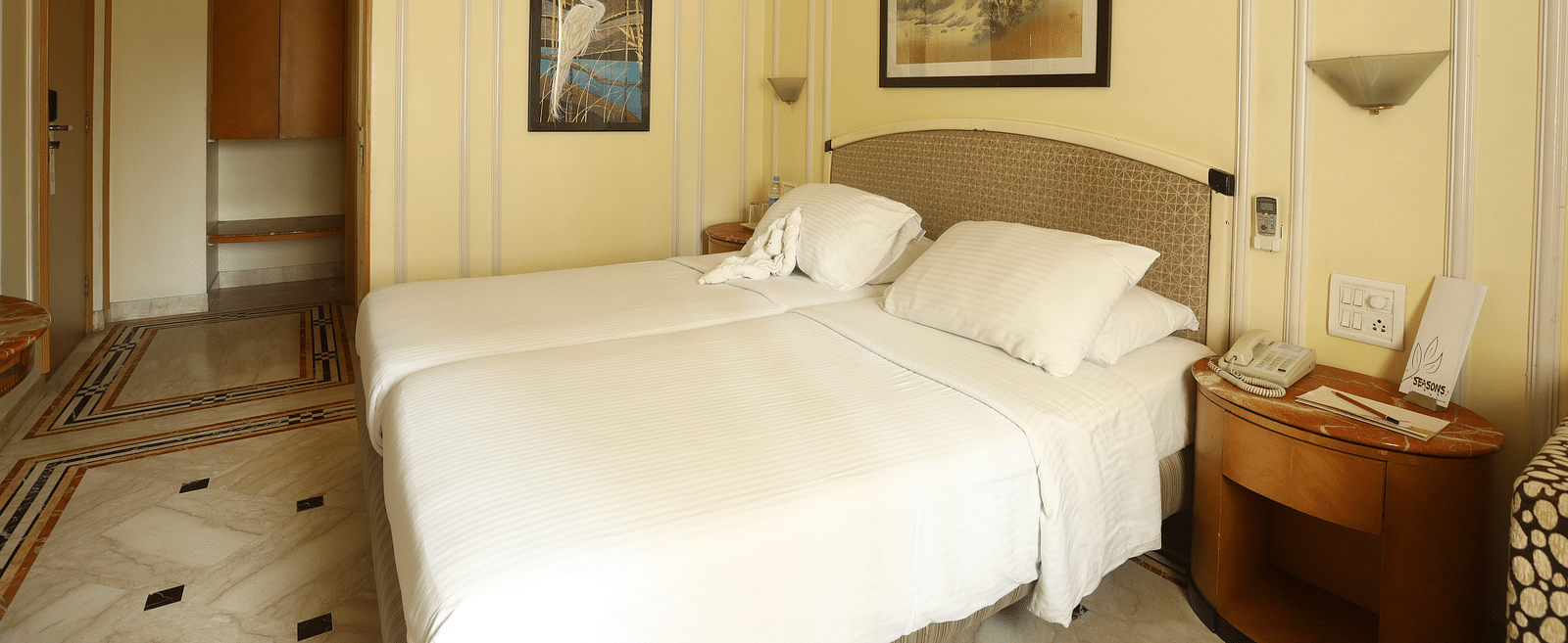 Twin beds in the Standard Room at Regency Hotel, Mumbai.