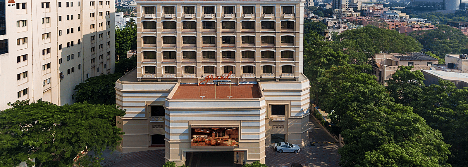 Facade view of Grand Chennai By GRT Hotels during day time.