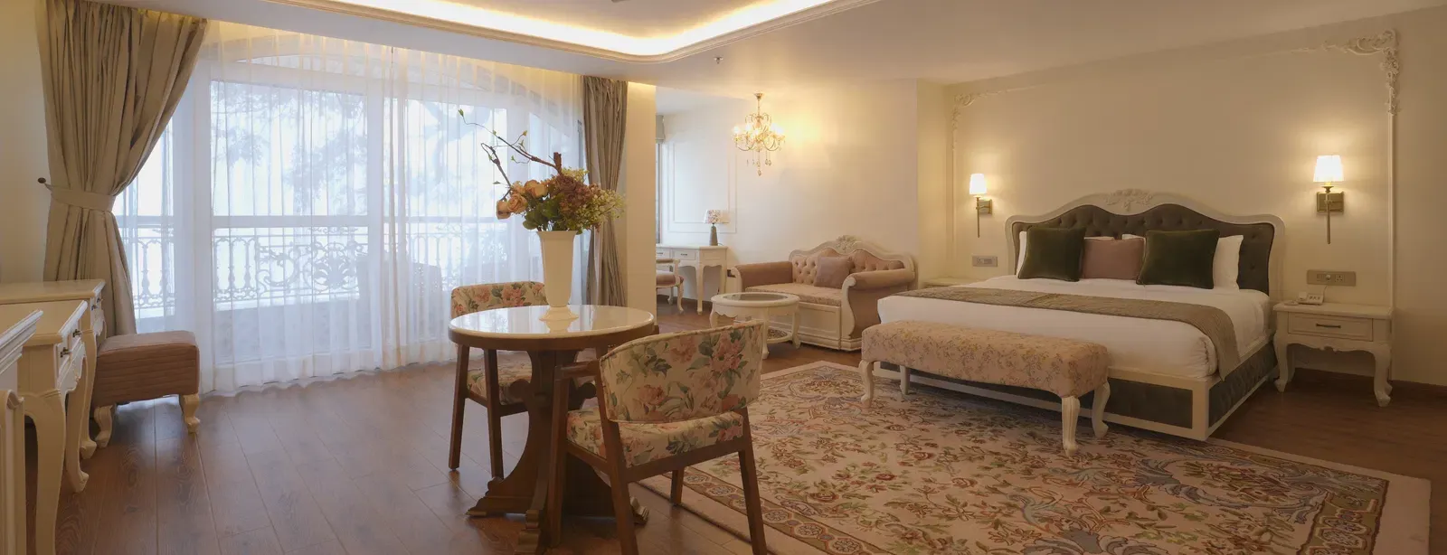 Spacious suite with queen size bed, wooden floors, and soft ceiling illumination - Mayfair Cafe & Suites, Dalhousie