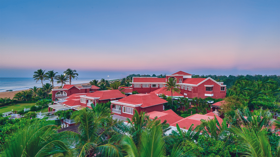 Panoramic view of MAYFAIR Heritage resort surrounded by lush greenery in Puri, Odisha