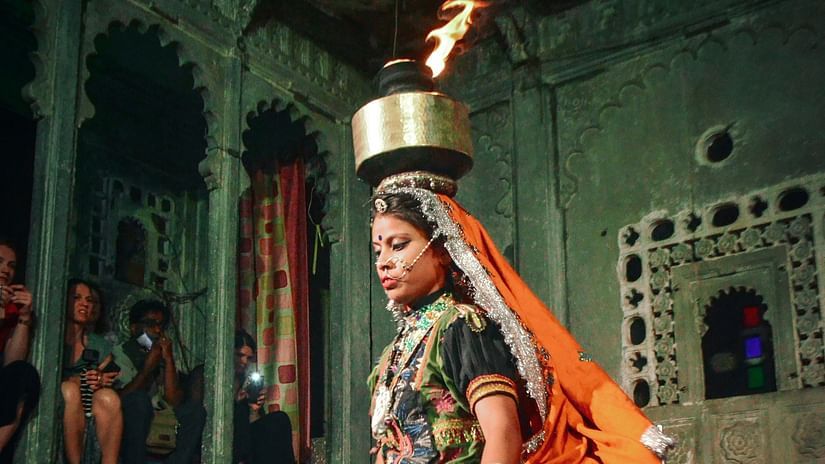 a cultural performance by a woman inside bagore ki haveli 