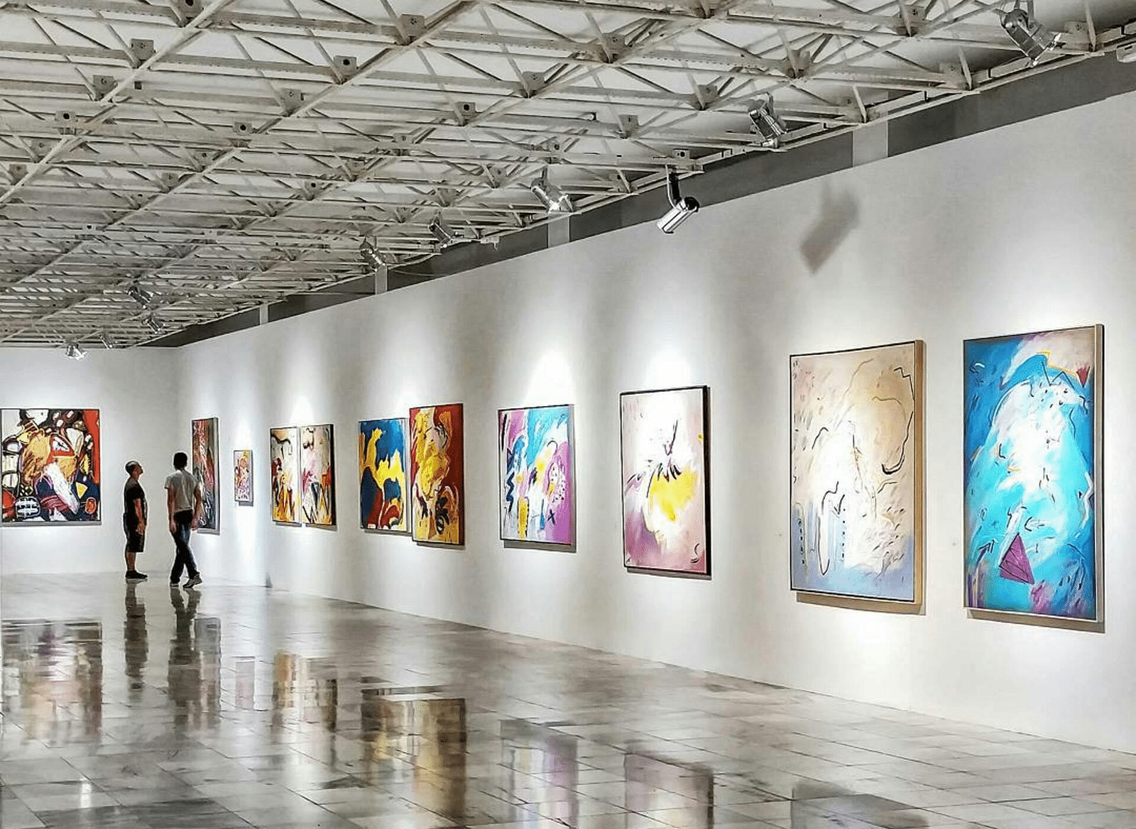 An art gallery with wall-mounted displays.