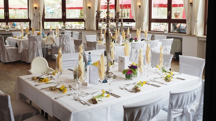 an image of banquet hall with  cutlery 