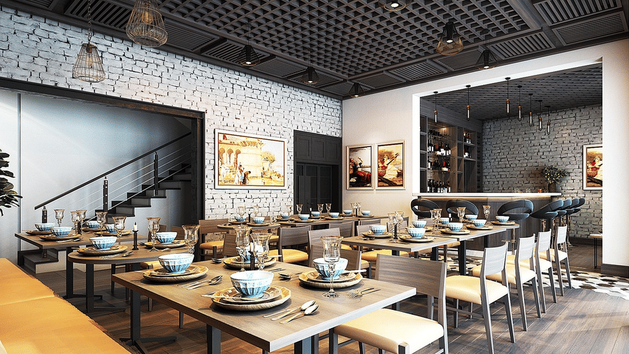 A contemporary dining area with many tables and chairs set up for meals in an open-plan space.
