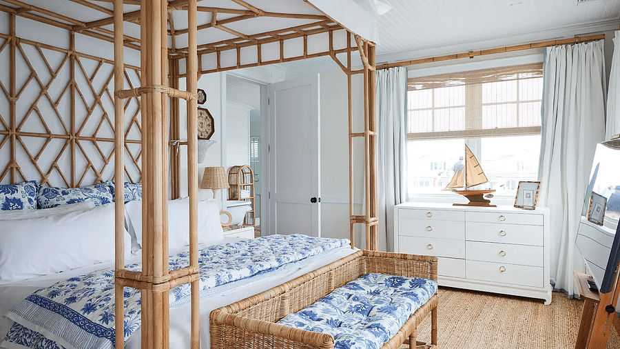 Bedroom with a canopy bed, nautical decor, and large windows | Abaco Inn