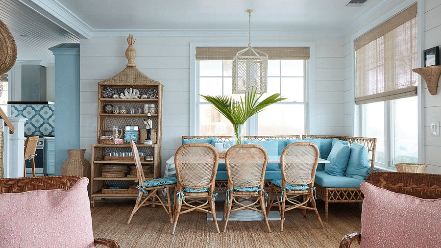 Dining area with a wooden table, wicker chairs, and coastal decor | Abaco Inn