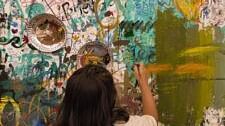 A girl painting the wall