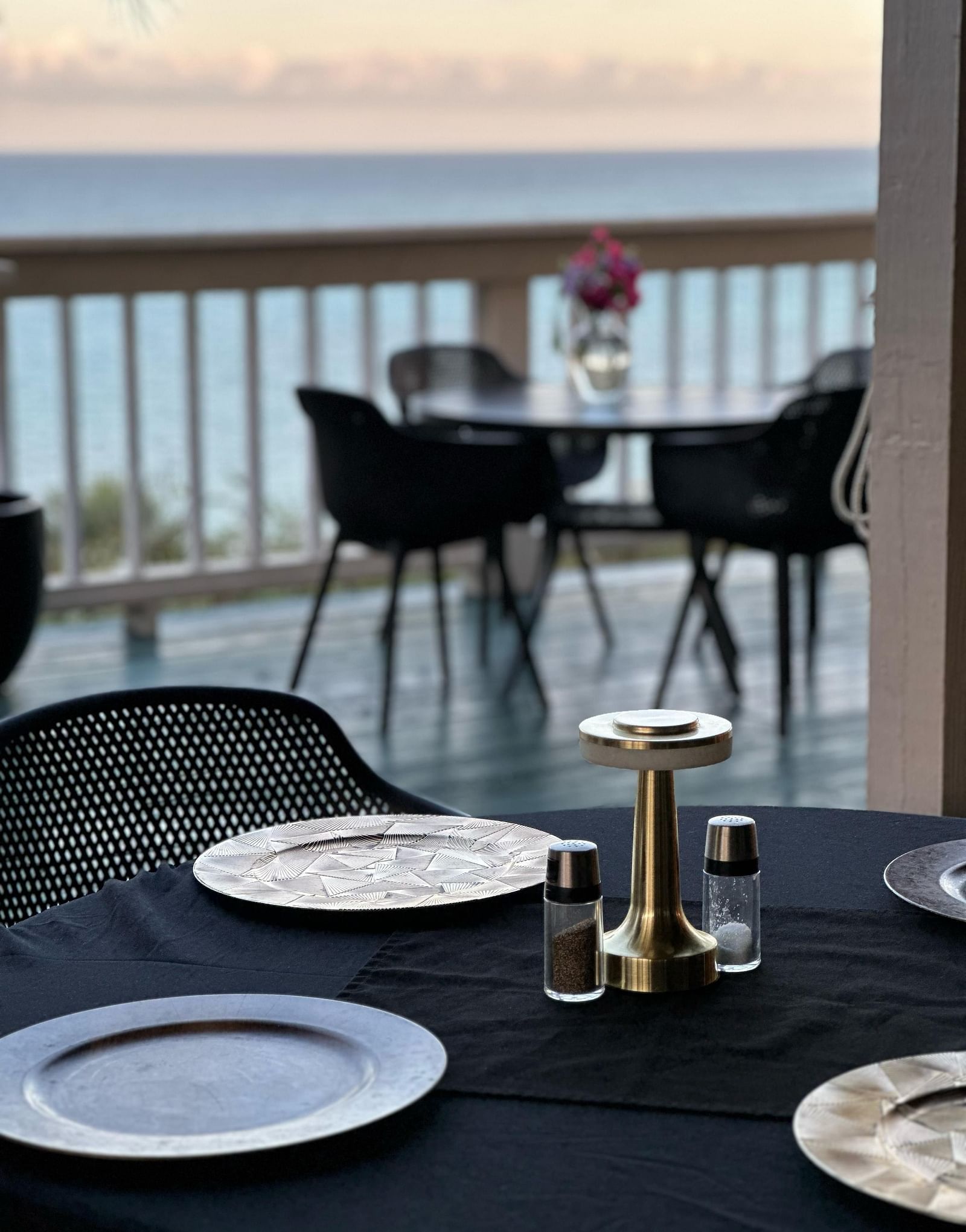 A table set with plates and cutlery overlooking ocean view | A Stone's Throw Away