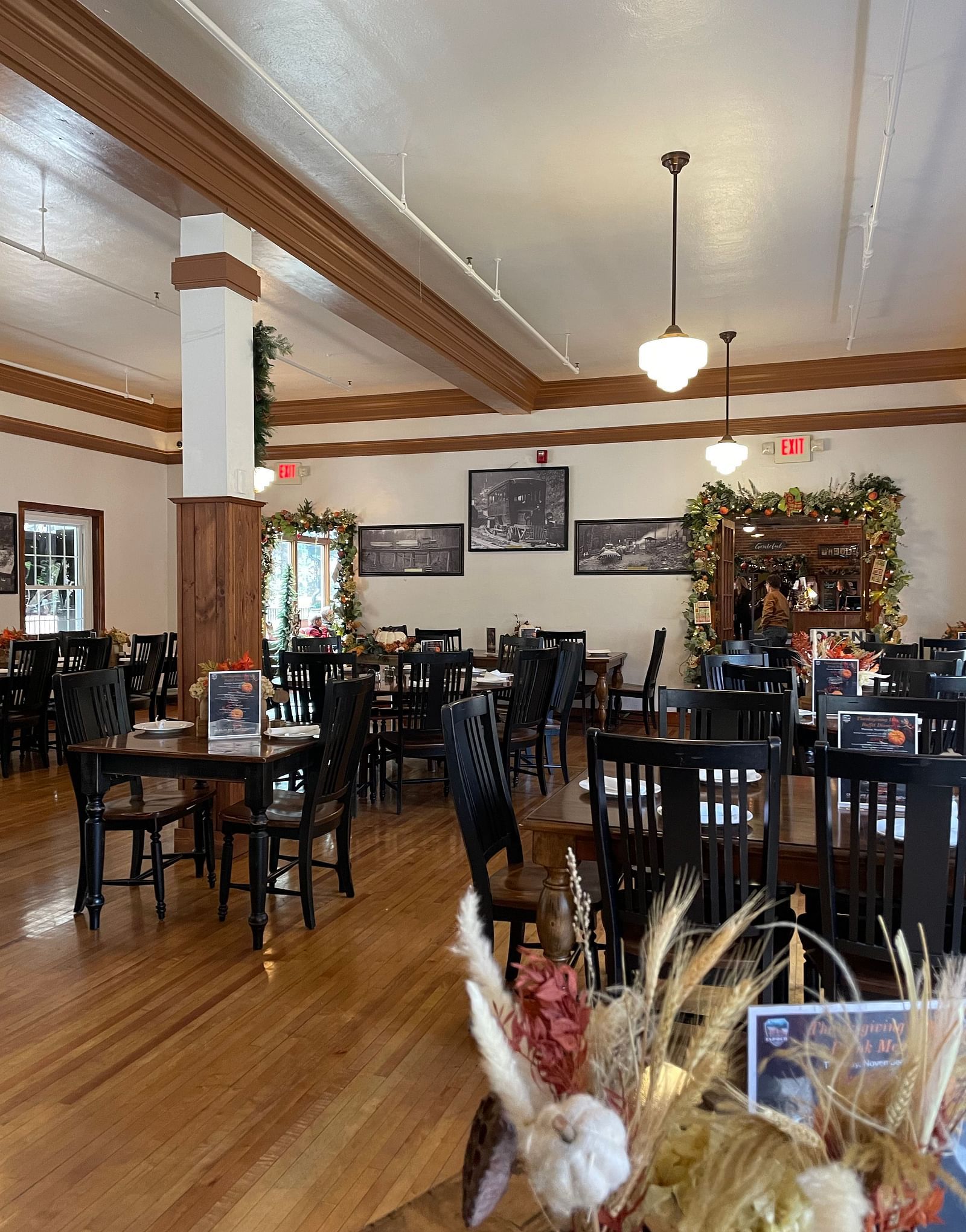 cozy interiors of the Cheoah Dining Roomwith tall pillars and wooden flooring - Historic Tapoco Lodge