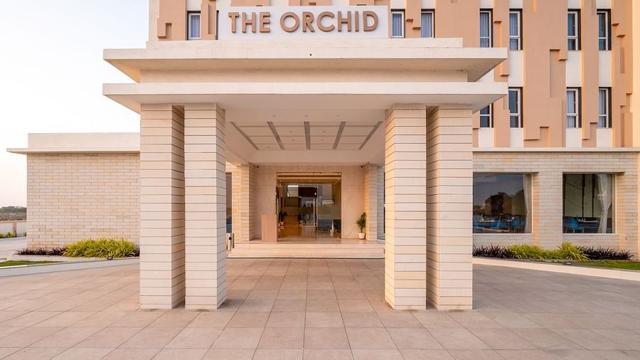 Entrance to the hotel with the signage of The Orchid above - The Orchid Hotel, Jamnagar