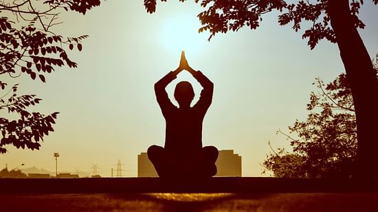 A person performing yoga captured in  the day time