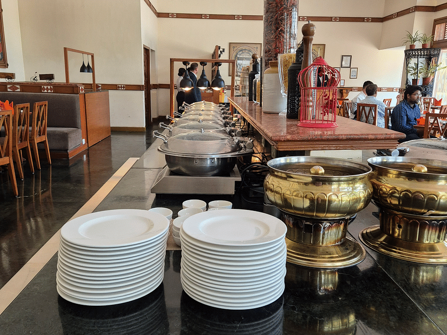 Close-up image of the Jacaranda Buffet, featuring elegant cutlery and plates beautifully arranged on the table at The Ummed Ahmedabad.