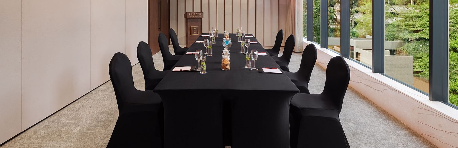  Carnival 1 with comfortable chairs facing towards the table at Essentia Premiere, Pune