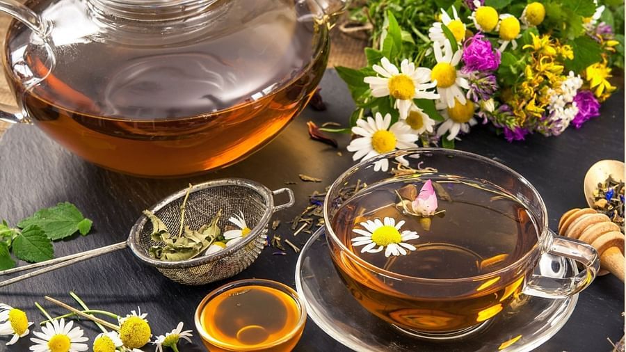 an image of a herbal Tea served in a glass cup and teapot - Rhythm Lonavala