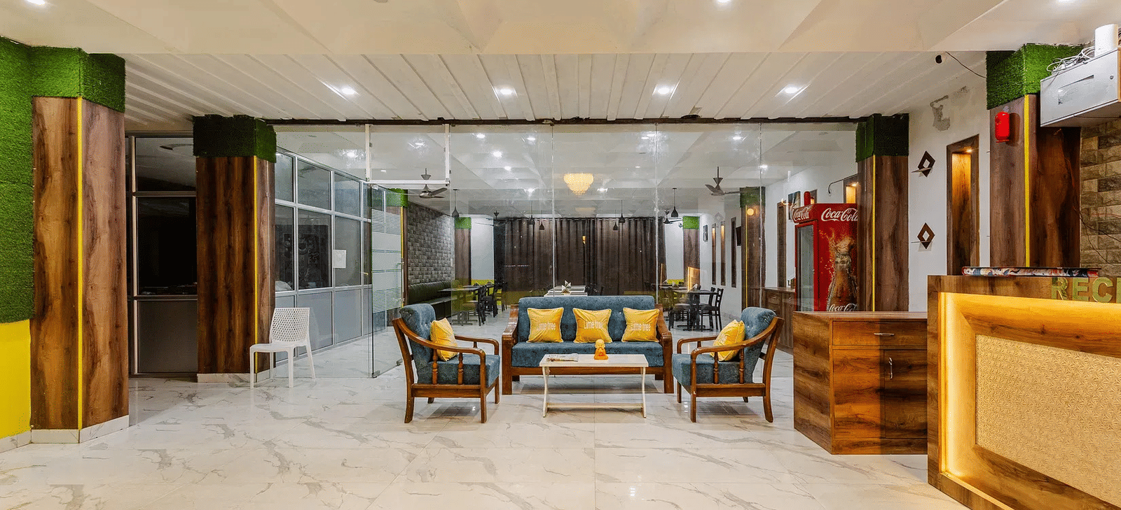 A spacious hotel lobby with a reception desk and multiple seating arrangements - Lime Tree Hotels & Banquet, Vrindavan