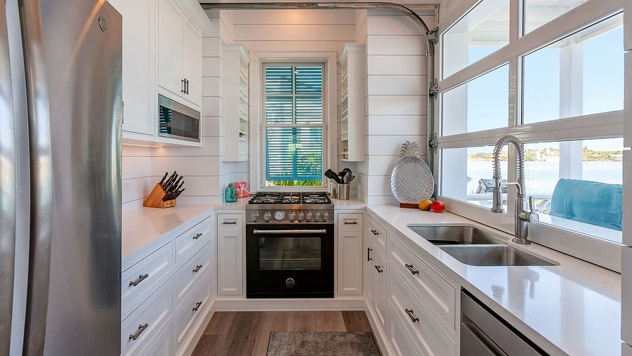 Modern kitchen with stainless steel appliances and white cabinetry | Abaco Inn
