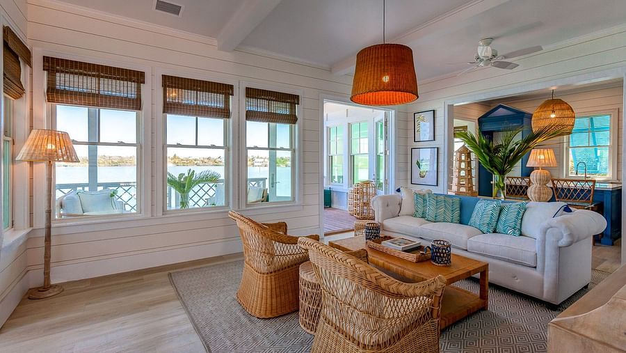 Cozy living space with wicker furniture and white sofas | Abaco Inn