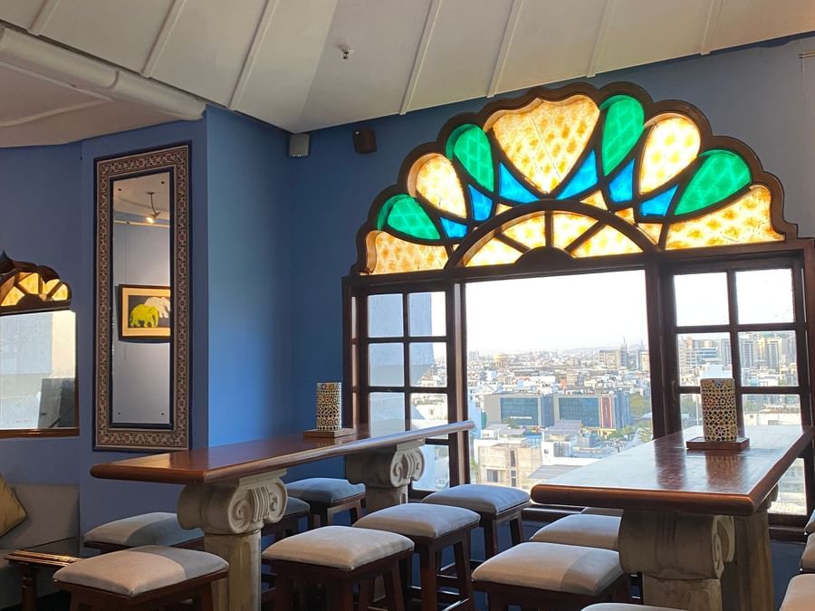 The tall chaired tabled at ta BLU Rooftop Bar at Clarks Amer, Jaipur