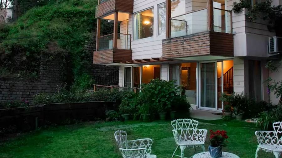 Exterior view of SOUTHGATE KASAULI BY ZENQ with a lawn near the entrance. 