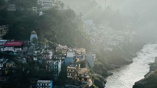 A River flowing beside a town and merging with another river - Ramgarh Bungalows, Nainital.