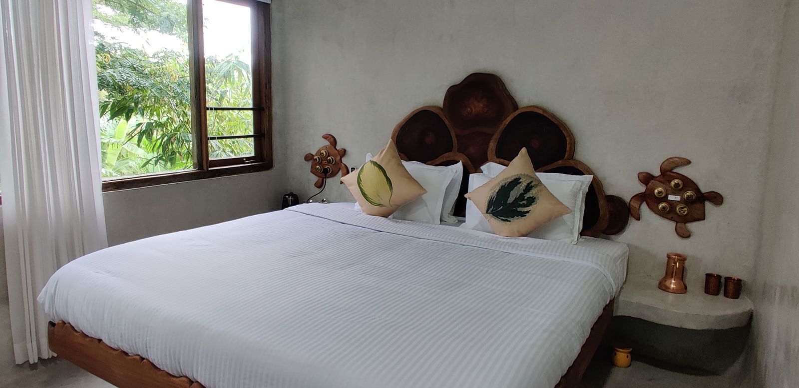 Albacore-1-King-size bed in the Deluxe Albacore Room, offering luxury and comfort for two guests.