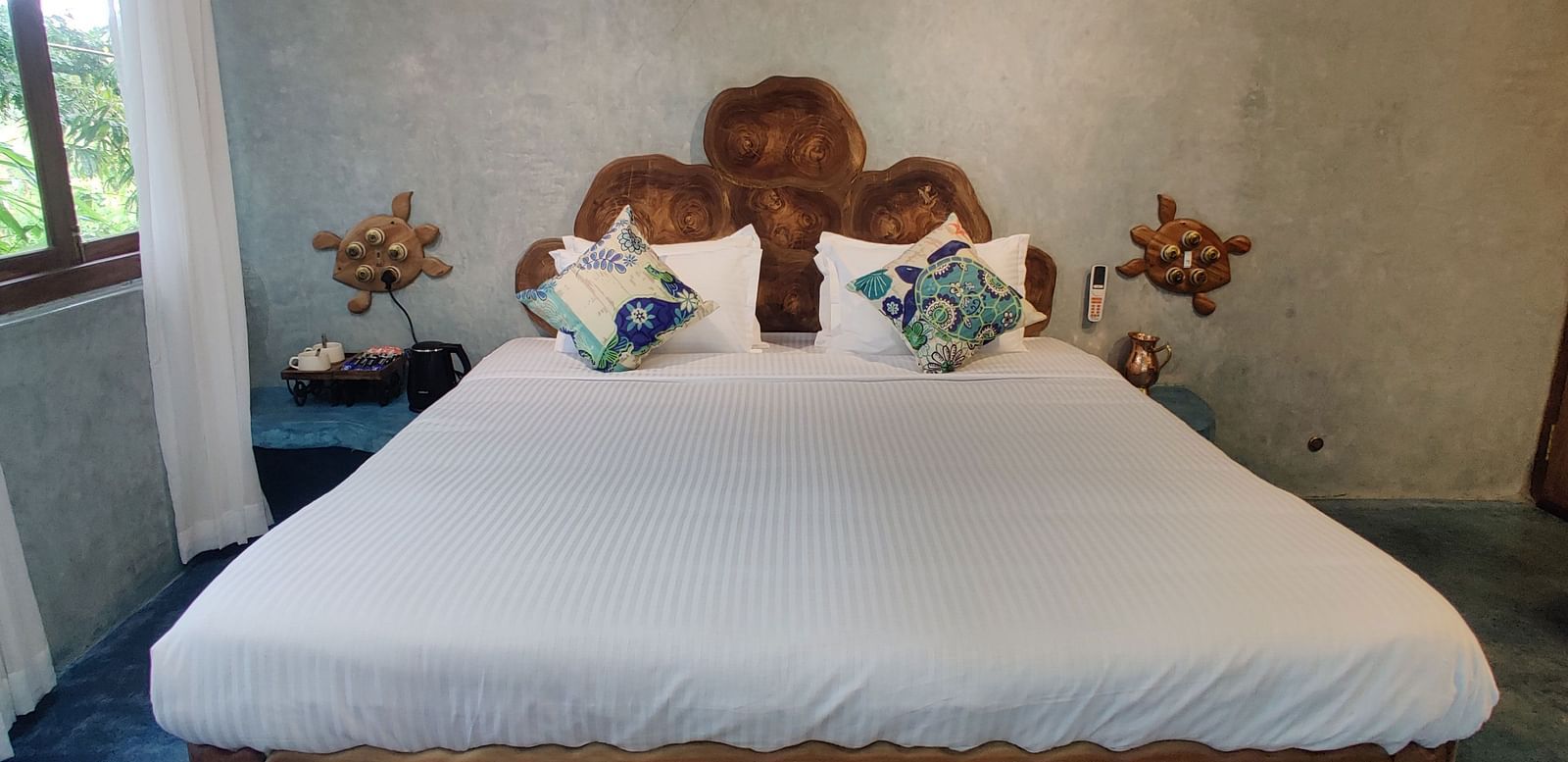 Luxurious Ocean Room, 266 sq. ft., with a king-size bed and a rug below it ensuring comfort and luxury at its best.
