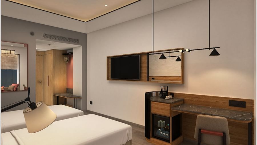 twin beds and amenities inside a Deluxe Twin room at Sarovar Portico Birgunj