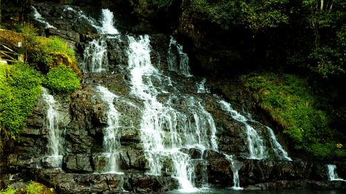 An overview of Elephant Falls in Shillong with water cascading down the rocks