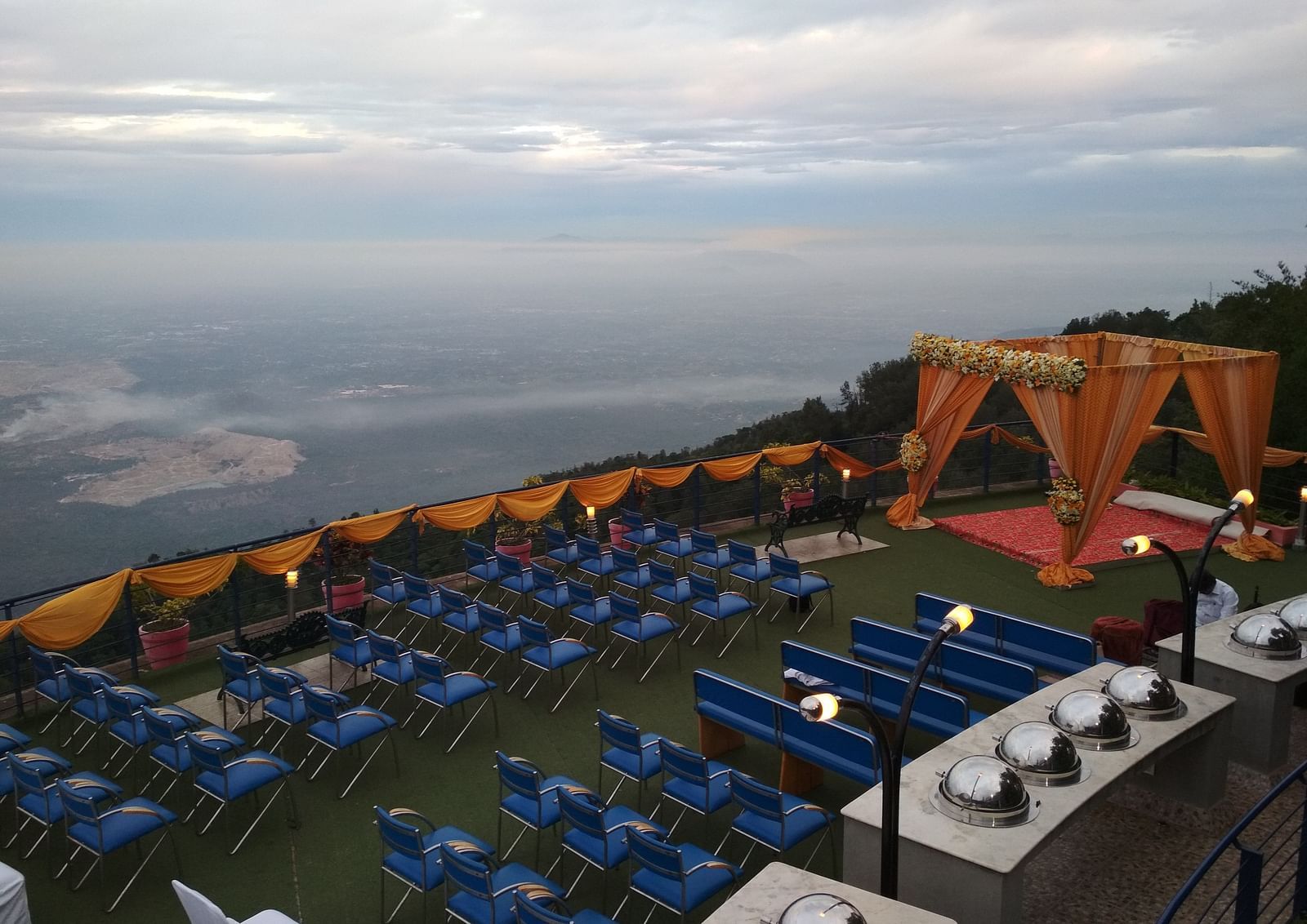 An image of the open banquet space with chairs and decoration - Great Trails Yercaud by GRT Hotels