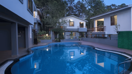 A hotel with outdoor swimming pool at TGI Hotels and Resorts