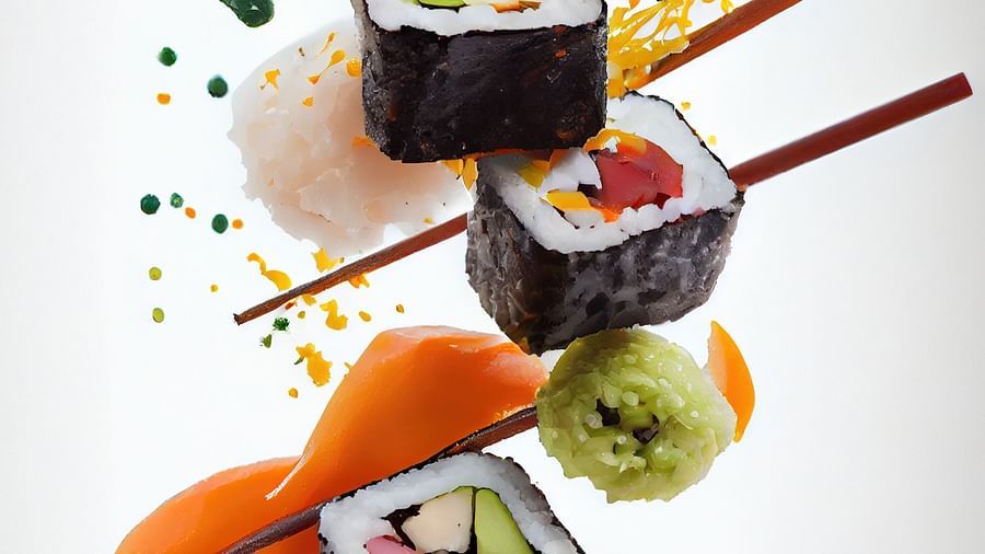 Sushi pieces artistically suspended in the air with colorful garnishes, against a white background - Themis Barbecue House, Ambience Mall, Gurugram