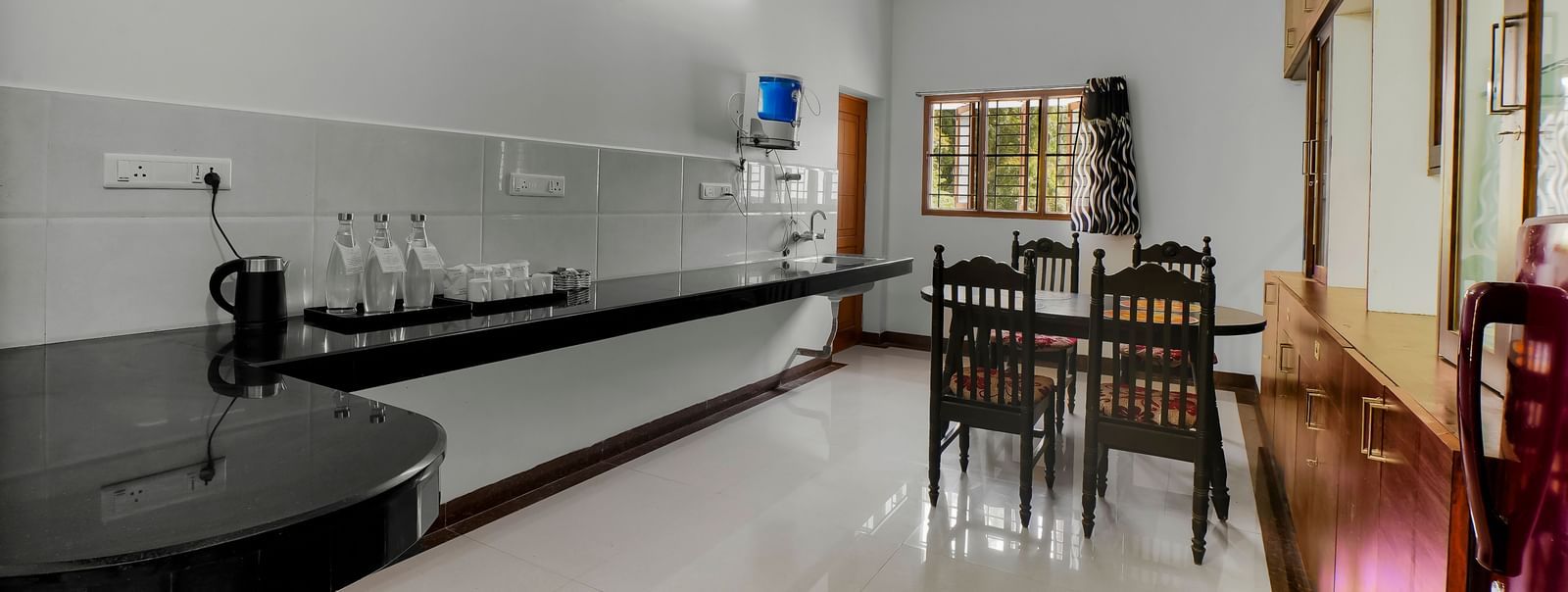 Long, well-lit kitchen and counter area at WOW Bungalow, Yercaud.