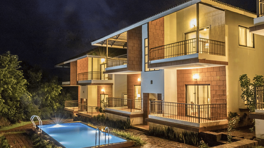  The resort is surrounded by greenery, with trees and shrubs visible in the background, suggesting a natural setting.