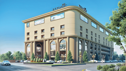 A grand, multi-storey hotel building with tall arches and glass windows.