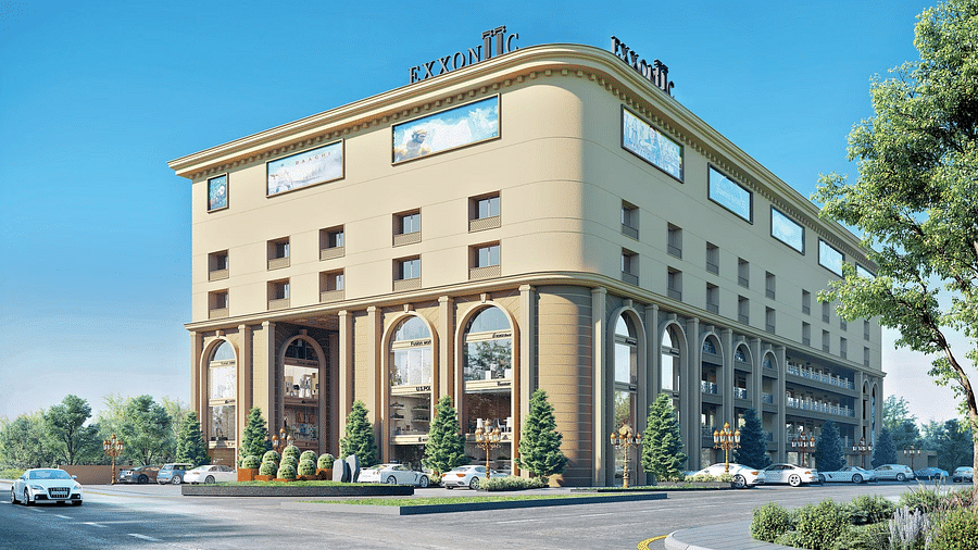 A grand, multi-storey hotel building with tall arches and glass windows.