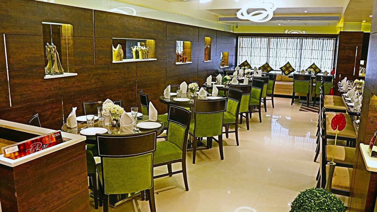 Image of dining space with tables and chairs at The Oriental Residency
