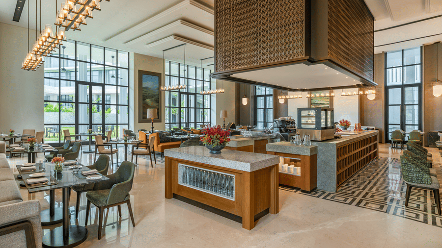 Chithirai restaurant featuring a coffee counter with floral accents at The Residency Signature Madurai.