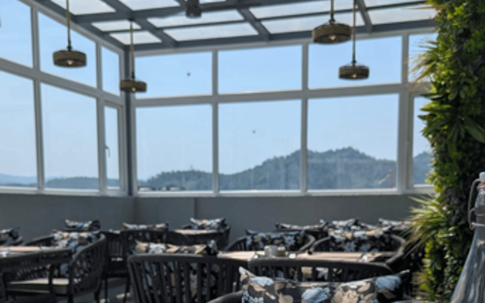 The glass-enclosed terrace at Signum Caf&eacute;, Signum Tathastu Boutique Hotel, Haridwar