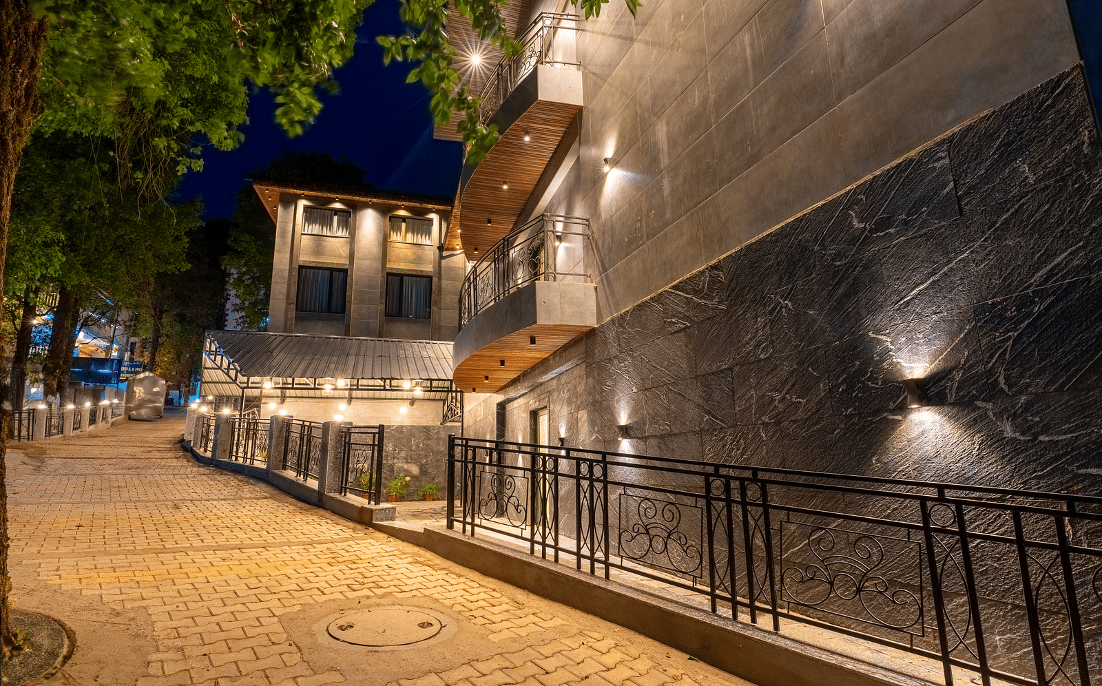 An image of a well lit facade of Bedzzz Xclusiv Ikshana Luxe during night
