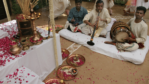 A group of musicians playing their musical instruments during a wedding celebration - Ramgarh Bungalows, Nainital.