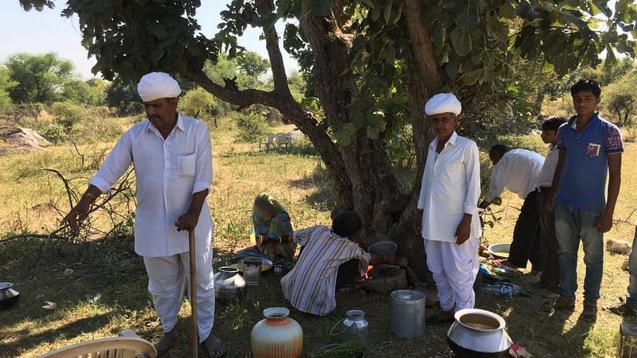 Locals preparing a meal in the field - Dev Shree, Deogarh