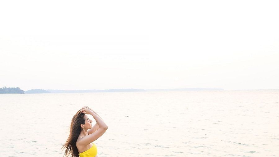A girl on the beach near to Silver Sand Sea Princess Beach Resort, Port Blair