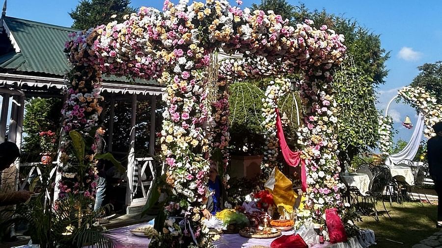 Outdoor wedding mandap at Cedar Inn, Darjeeling, placed on a garden platform with elegant floral detailing.