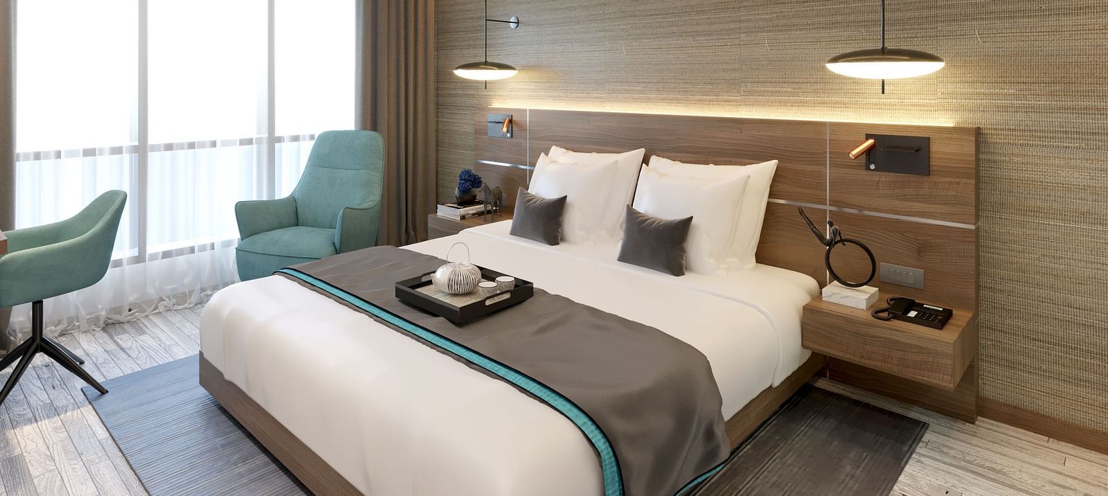 One Bedroom Suite in Kinshasa at Kertel Suites featuring a plush double bed with an arm chair besides it