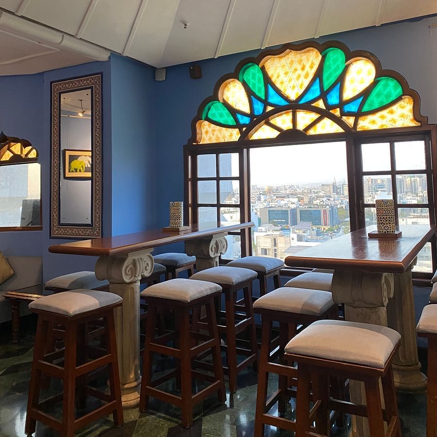 The tall chaired tabled at ta BLU Rooftop Bar at Clarks Amer, Jaipur