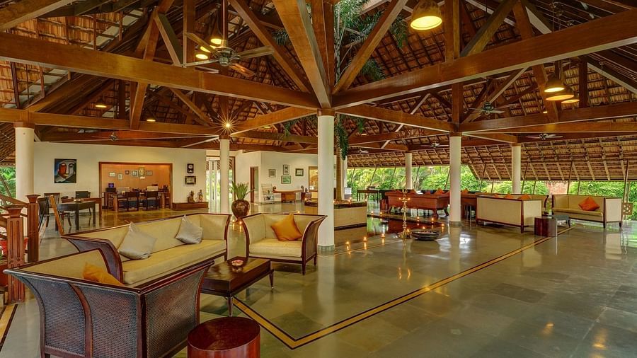 Cream-coloured couches in lobby - Rhythm Kumarakom