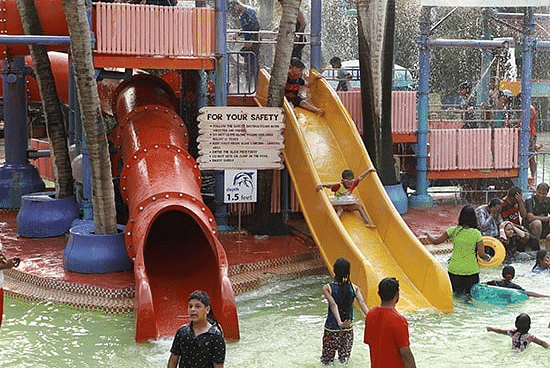 Water Kingdom - a group of people in a play area at our water park