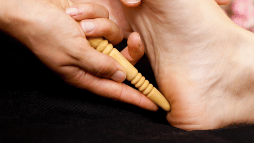 a person receiving a foot massage