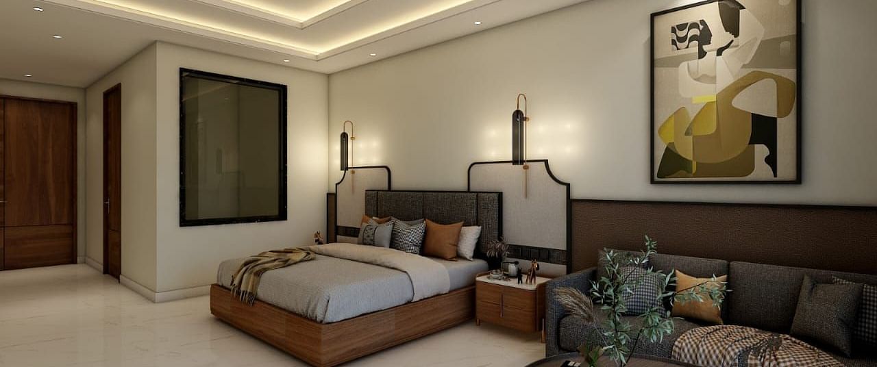 A bedroom with slightly low lighting featuring a double bed with an artistic head board along with a common seating area besides it. - Namaste Corbett