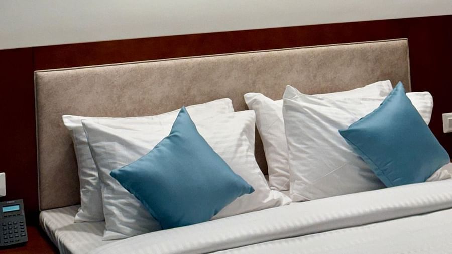 Image of Executive King Room with a bed and photo frames above the bed at Le Royale Palace.